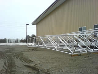 Here is an example of a custom wood and aluminum ADA handrail