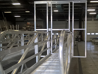 Aluminum gangway from shore to dolphin.